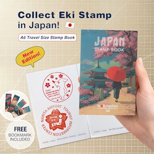 May include: An A6 travel size stamp book featuring a cover illustration of a person with a red umbrella walking near a temple under cherry blossoms. The book includes pages with red ink stamps and comes with a set of bookmarks. Text includes Collect Eki Stamp in Japan, Japan Stamp Book, and New Edition.