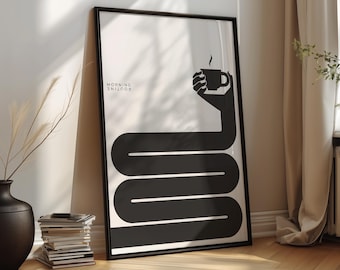 May include: A framed vertical poster featuring a black and white graphic design. The artwork displays a long, winding black arm extending from the bottom to hold a steaming cup of coffee at the top. The text MORNING ROUTINE is printed in small black letters on the left side.