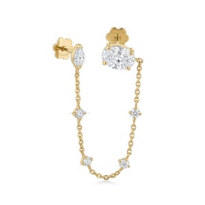 May include: A pair of gold earrings with a chain design. One earring features a pear-shaped diamond, while the other has an oval-shaped diamond. Both are connected by a delicate gold chain with four smaller diamonds.