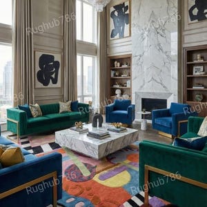 May include: A luxurious living room featuring a large, colorful rug with abstract shapes, surrounded by green and blue velvet sofas and armchairs. A marble coffee table sits in the center, and a chandelier hangs from the high ceiling.