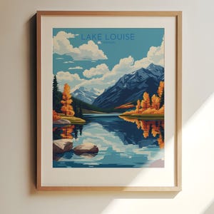 May include: A framed art print of Lake Louise, Canada. The artwork depicts a serene lake reflecting the surrounding mountains, trees, and sky. The color palette includes blues, greens, oranges, and whites, creating a tranquil landscape scene.