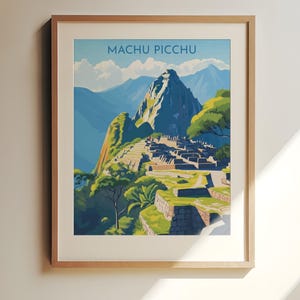 May include: A framed art print featuring a vintage-style illustration of Machu Picchu. The artwork showcases the ancient city nestled in the mountains, with the text "Machu Picchu" at the top. The color palette includes blues, greens, and browns.