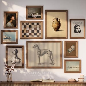 May include: A gallery wall of framed vintage art prints. The collection features diverse artworks, including portraits, landscapes, and a greyhound illustration. The frames are a warm brown, creating a cohesive display. The prints are in various sizes.