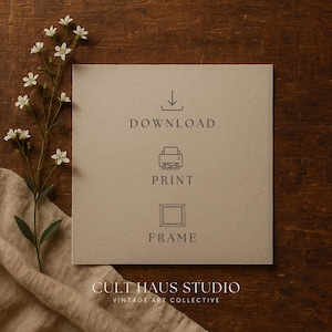 May include: A square, beige paper with the words "DOWNLOAD", "PRINT", and "FRAME" in gray. A sprig of white flowers and a beige cloth are on a dark wood surface. The text "CULT HAUS STUDIO VINTAGE ART COLLECTIVE" is at the bottom.