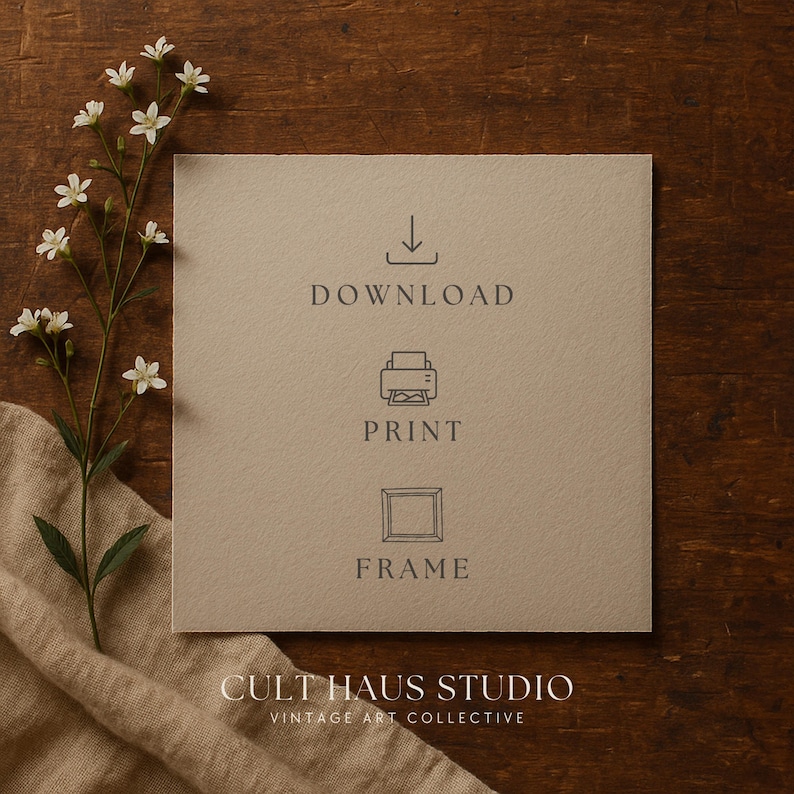May include: A square, beige paper with the words "DOWNLOAD", "PRINT", and "FRAME" in gray. A sprig of white flowers and a beige cloth are on a dark wood surface. The text "CULT HAUS STUDIO VINTAGE ART COLLECTIVE" is at the bottom.