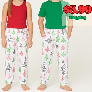 May include: Two children wearing matching Christmas pajamas. One child is wearing a red tank top, the other a green t-shirt. Both children are wearing white pajama pants with a Christmas tree pattern in red, green, and black.
