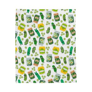 May include: White fabric featuring a repeating pattern of cartoon pickles, jars of pickles, and pickle characters. The jars are labelled "Pickles" and have brown lids. The pickles are green with smiling faces.