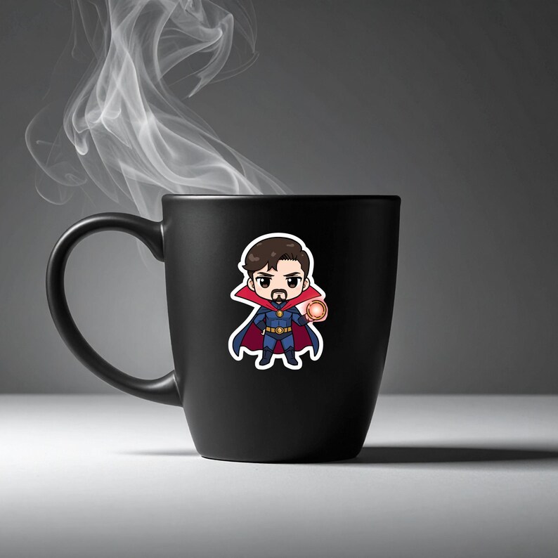 May include: A black ceramic mug with a cartoon sticker of Doctor Strange. The sticker depicts the character in a blue and red costume, holding an orange energy ball. Wisps of white steam rise from the mug.