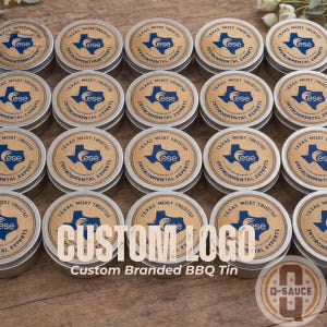 May include: A collection of small, round metal tins with custom branding. Each tin has a brown label with the text "TEXAS MOST TRUSTED" and a blue Texas outline logo. The text "CUSTOM LOGO" is prominently displayed.
