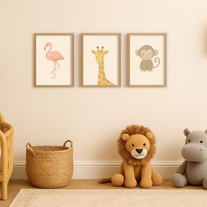 May include: Three framed watercolor animal prints: a flamingo, a giraffe, and a monkey. A plush lion and hippo sit on the floor. A woven basket and a crib are also in the room. A small shelf holds a rainbow.