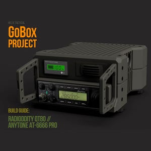 May include: A dark gray GoBox Project with the text "GoBox Project" in orange. The box has an open door revealing a radio with a green display showing "285.000-". The top of the box has a green display showing "100%". The build guide is for Radioddity QT80 and AnyTone AT-6666 Pro.