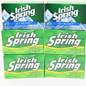 May include: Six rectangular bars of Irish Spring deodorant soap arranged in two columns. The top two boxes are labeled Icy Blast with a mountain graphic, net weight 3.7 oz. The bottom four boxes are labeled Original, net weight 5 oz.