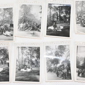 May include: A collection of eight vintage black and white photographs featuring outdoor scenes. Several images depict small, custom-built race cars with the number 4 visible on the side, while others show groups of people gathered in park settings.