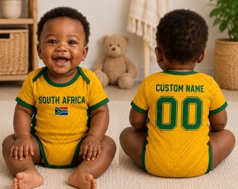 May include: Two babies wearing yellow and green South Africa themed onesies. The front of the onesie has the words "SOUTH AFRICA" and the South African flag. The back of the onesie says "CUSTOM NAME" and the number "00".