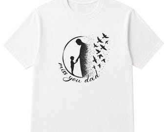 May include: White t-shirt featuring a black graphic of a parent and child holding hands inside a circle, with birds flying away. The text "miss you dad" is written in cursive. A touching memorial tee.