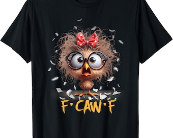 May include: Black t-shirt featuring a cartoon chick with glasses and a red polka dot bow. The chick has fluffy brown feathers and is surrounded by white feathers. The text "F CAW F" is printed below the chick.