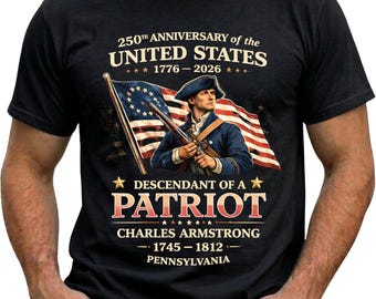 May include: Black t-shirt featuring a patriotic design commemorating the 250th anniversary of the United States. The graphic includes an illustration of a historical figure, the American flag, and text that reads "Descendant of a Patriot" and "Charles Armstrong 1745-1812 Pennsylvania."