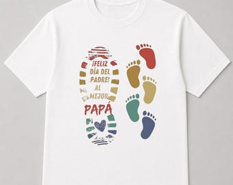 May include: White t-shirt with a colorful design for Father's Day. The design includes the text "¡FELIZ DÍA DEL PADRE! AL MEJOR PAPÁ" and several footprints in various colors.