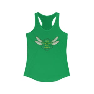 May include: Green racerback tank top with a graphic of dragonfly wings and the text "THIS CRITTER HAS WINGS" in a geometric design. The tank top is made of a soft, lightweight material.