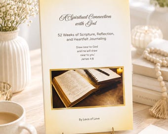 May include: A rectangular book titled A Spiritual Connection with God, 52 Weeks of Scripture, Reflection, and Heartfelt Journaling, featuring the text Draw near to God and He will draw near to you James 4:8 and By Lexis of Love with a central photo.