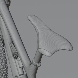 May include: A detailed wireframe rendering of a bicycle, showcasing the seat, frame, and tire. The seat is a contoured shape, and the tire has a textured tread. The image is a grayscale rendering, highlighting the structural design.