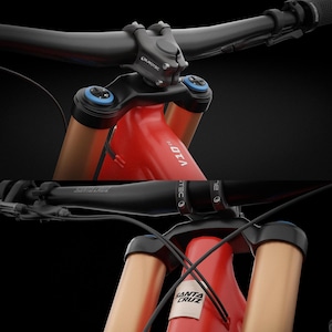 May include: A red mountain bike frame with a black handlebar and stem. The frame features the text V10 and Santa Cruz. The front suspension forks are metallic bronze with blue adjustment caps. Black cables are routed along the front of the frame.