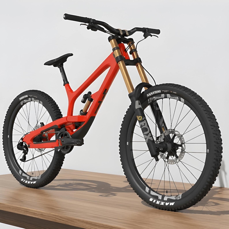 May include: A red mountain bike with black tires and gold suspension forks. The bike has a black seat and handlebars. The tires have white lettering that reads "MAXXIS". The bike is on a wooden surface.