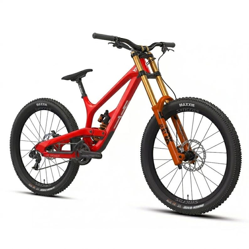 May include: A red mountain bike with black tires and a black seat. The front suspension is orange and gold. The bike has the text "Yeti" on the frame and "Maxxis" on the tires.