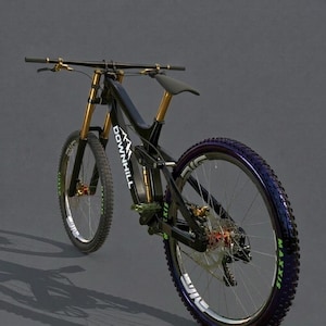May include: A black and gold downhill mountain bike with the word "DOWNHILL" printed on the frame. The bike has gold handlebars and suspension forks, with black tires and rims. The tires have green lettering and the rims have white lettering.