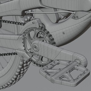 May include: Close-up of a bicycle's rear wheel and drivetrain. The image shows the chain, gears, and pedal in detail. The components are gray and appear to be made of metal. The tire has a textured pattern.