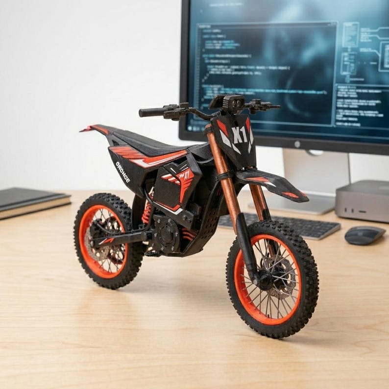 May include: A black and red toy motorcycle with orange accents, featuring the text "X1" and "ORONGE". The motorcycle has knobby tires and is displayed on a wooden surface.