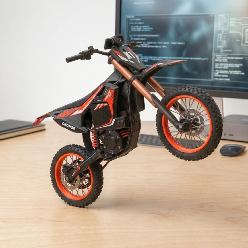 May include: A black and red toy motorcycle with orange accents is captured mid-wheelie. The motorcycle features the text "OHONGE" and "X1". The tires and rims are orange. The motorcycle is on a wooden surface.