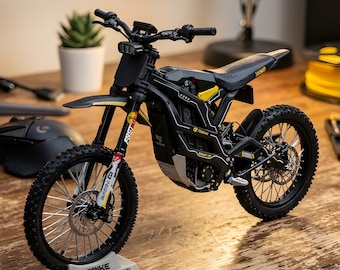 May include: A detailed scale model of a black and yellow 79BIKE Falcon GT motorcycle. The model features realistic details, including tires, suspension, and a seat. The base reads "79BIKE FALCON GT - SCALE MODEL".