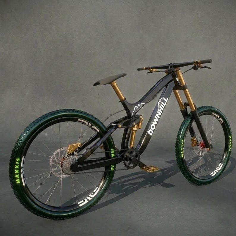 May include: A black and gold downhill mountain bike with green tires. The bike has the word "DOWNHILL" printed on the frame. The wheels have the word "MAXXIS" printed on them. The bike has a black seat and gold accents.
