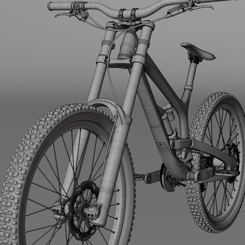 May include: A wireframe rendering of a mountain bike, showcasing its components. The bike features knobby tires, disc brakes, and a suspension system. The handlebars, seat, and frame are visible, highlighting the bike's design.