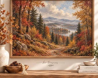 May include: A framed landscape painting depicting an autumn forest with vibrant orange, red, and yellow foliage, evergreen trees, a winding path, and distant mountains near a lake. The text kw treasures is printed below the artwork.