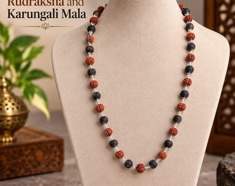 May include: A necklace featuring alternating textured reddish-brown Rudraksha beads and smooth matte black Karungali beads, linked by small silver-toned metal spacers. The text Natural Rudraksha and Karungali Mala is visible above.