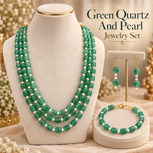 May include: A jewelry set featuring a three-strand necklace, a bracelet, and drop earrings made of green quartz beads and small white pearls. The text Green Quartz And Pearl Jewelry Set is displayed in the upper right corner of the image.