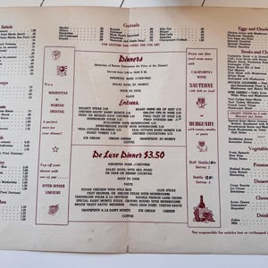 May include: A vintage paper restaurant menu featuring a cream-colored background with dark red text. The menu lists various food categories including salads, soups, entrees, and desserts, with prices in dollars. It includes sections for cocktails and wine.