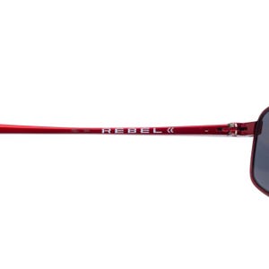 May include: Red sunglasses with the word "REBEL" printed in white on the temple. The sunglasses have a sleek, modern design with dark lenses.