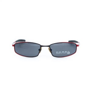 May include: Rectangular sunglasses with a black frame and red accents. The lenses are dark gray, and the text "REBEL 100% UV CAT. 3" is printed on the right lens. The sunglasses have a modern, sporty design.