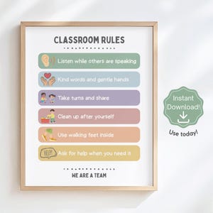 May include: A framed classroom rules poster with a light wood frame. The poster features colorful blocks with rules like "Listen while others are speaking" and "Ask for help when you need it." A green sticker says "Instant Download!" and "Use today!"
