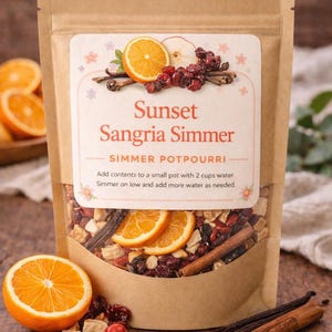 May include: A kraft paper bag of Sunset Sangria Simmer potpourri, featuring orange slices, cranberries, cinnamon sticks, and vanilla beans. The label includes the text "Sunset Sangria Simmer" and instructions for use.
