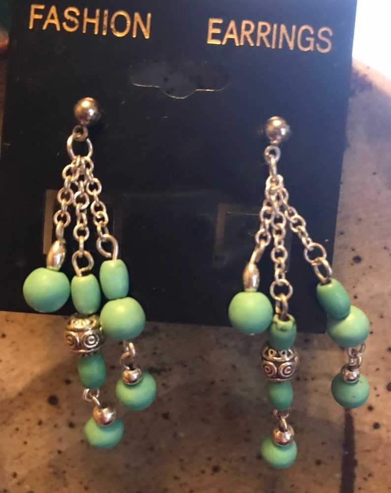 Silver and turquoise colored bead necklace and earrings
