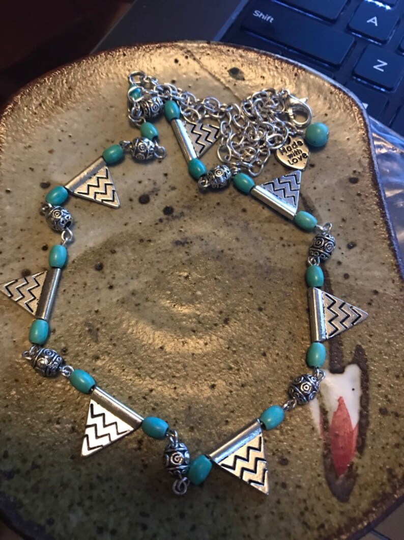 Silver and turquoise colored bead necklace and earrings