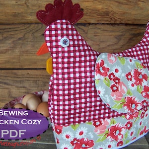 May include: A red and white gingham chicken-shaped sewing cozy with a floral fabric accent. The text "Sewing Chicken Cozy PDF" is on a purple oval.