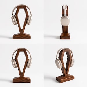 May include: A dark brown wooden headphone stand with a geometric, diamond-shaped frame and a rectangular base. The stand is shown from multiple angles, displaying a pair of light beige over-ear headphones resting on the top support structure.