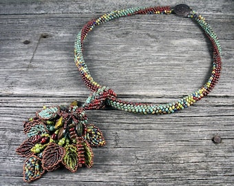 SOLD! Beadweaving: African Polygon Necklace in Burgundy and Green with Ceramic Leaves