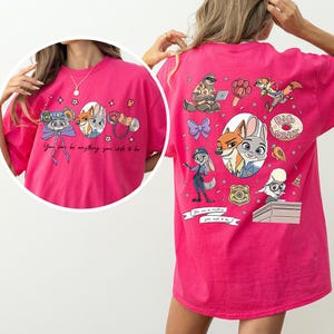 May include: A white ceramic mug with a black handle and the text "But First, Coffee" in a black, handwritten-style font. The mug is on a white surface.