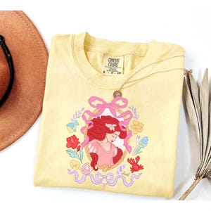 May include: A set of three ceramic canisters with lids. The canisters are white with a textured surface and feature a geometric pattern in shades of blue and grey. The lids are a matching blue.